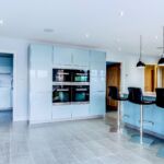 a modern and sleek kitchen in high gloss blue.