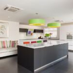 Monotone modern kitchen accessories with pops of bright colour. With LED plinth lights and under cupboard wall lights.